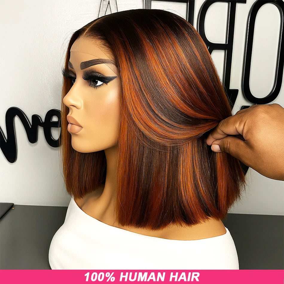 Person with brown ombre hair styled in a bob, with a hand adjusting the hair, set against a blurred indoor background.